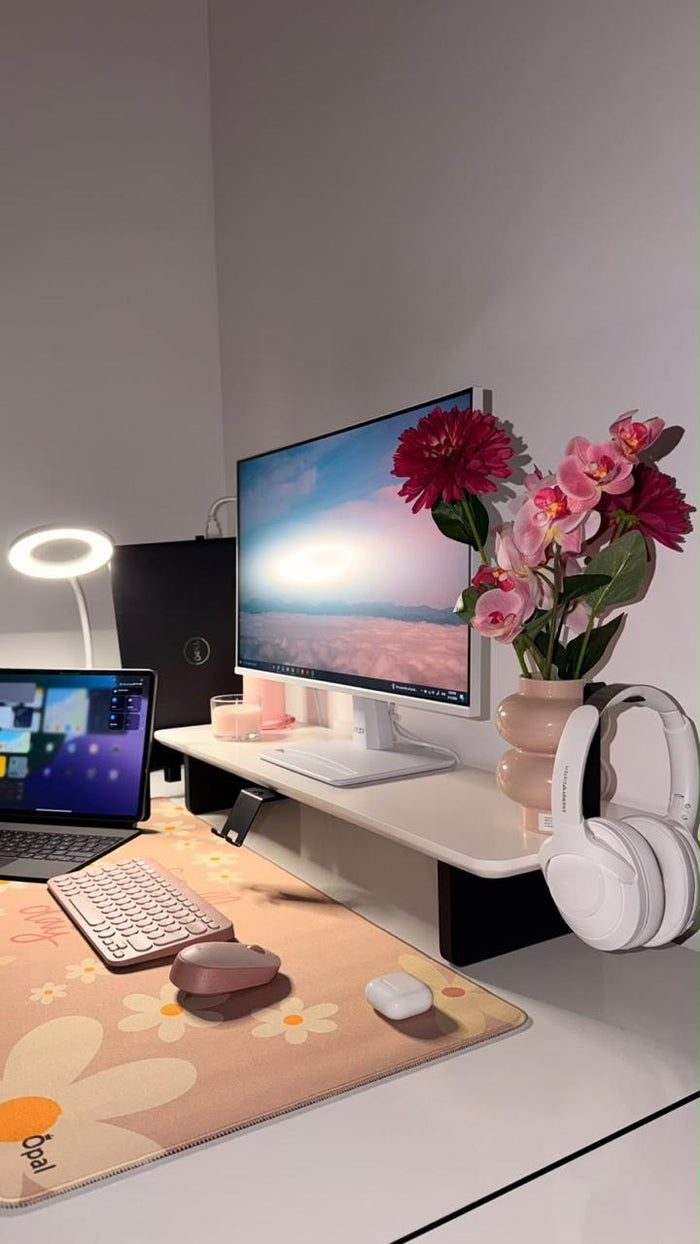 Matte white desk shelf with phone and headphone stands on a pastel desk